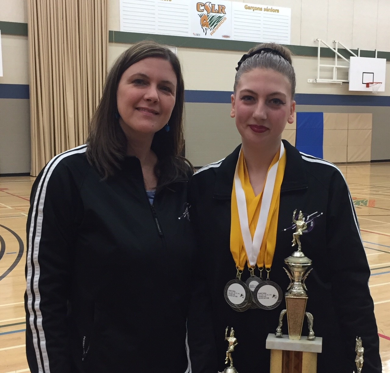 Baton instructors with trophies