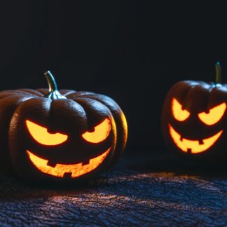 Jack-o-lanterns grin in the dark