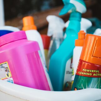 Bucket with variety of cleaning products.