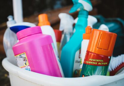 Bucket with variety of cleaning products.