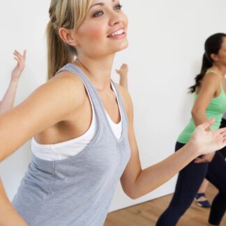 Women dancing in a gym class.