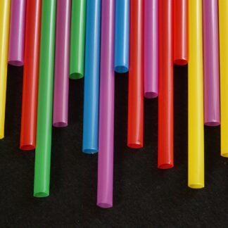 A variety of different coloured and lengths of drinking straws spread from both sides of the page.