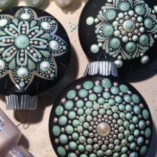 Holiday ornaments are painted with a variety of blue dots