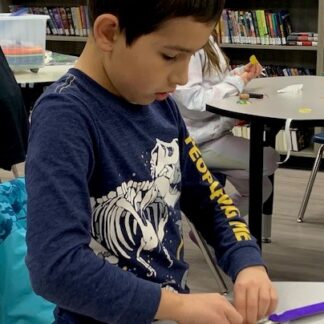 A child works on a small project