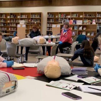 Class works with first aid dummy