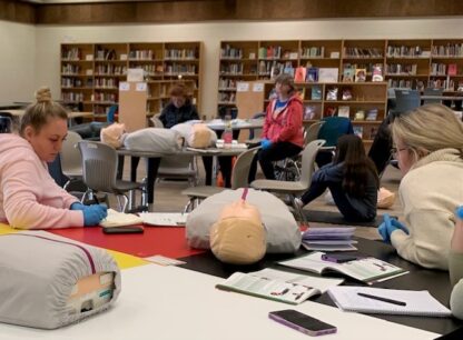 Class works with first aid dummy