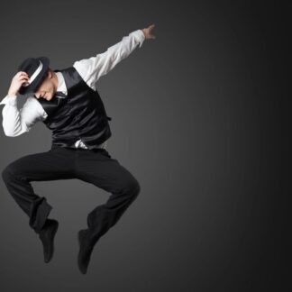 Man wearing hat and vest jumps in the air