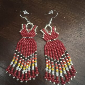 beaded earrings in the shape of a red dress