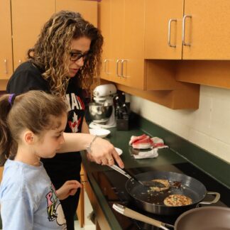 parent and child cooking together