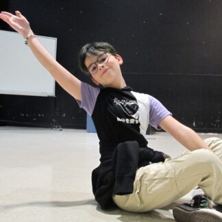 Child stretches flamboyantly