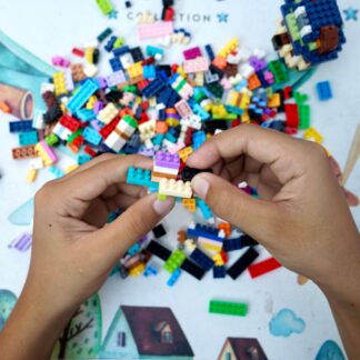 hands putting bricks together